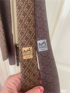 2 Hermès tours - one Brown Silk Tie with Red and the other a Gray Link Motif